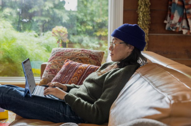 6 Proven Ways To Increase Company Proficiency 1 using laptop on comfortable couch