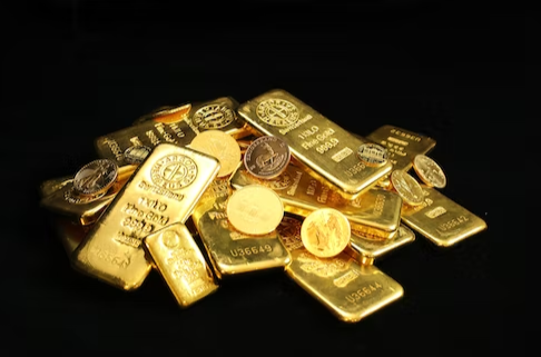pile of gold bars and coins