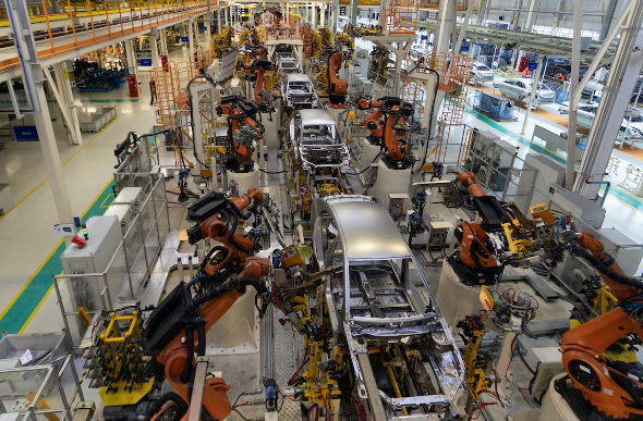How Are Robots Making Workspaces More Efficient And Worker-Friendly 2 automobile manufacturing plant