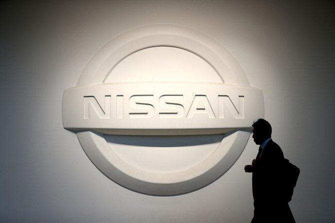 Renault Group will sell 5% of Nissan shares for €765 million 1 man walks by Nissan logo